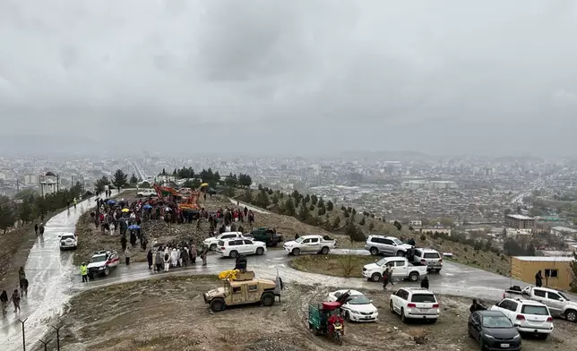 Bulldozers dig graves for victims of a Monday airstrike on a drug rehabilitation hospital in Kabul, Afghanistan, Wednesday, March 18, 2026. (AP Photo/Siddiqullah Alizai)