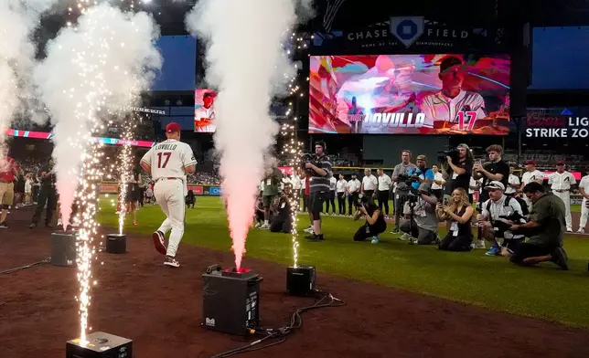 Arizona Diamondbacks manager Torey Lovullo (17) is introduced before their opening-day baseball game against the Detroit Tigers Monday, March 30, 2026, in Phoenix. (AP Photo/Darryl Webb)