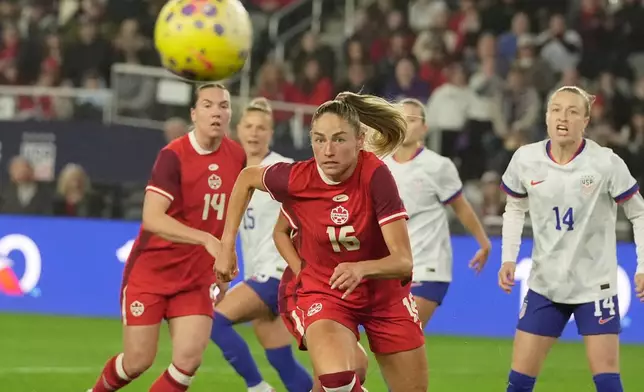 Canada midfielder Janine Sonis (16) chases after the ball in front of United States' Emily Sonnett (14) in the first half of a SheBelieves Cup women's soccer match in Columbus, Ohio, Wednesday, March 4, 2026. (AP Photo/Sue Ogrocki)