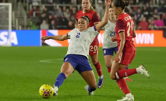 United States' Trinity Rodman (2) passes in front of Canada's Sydney Collins (24) in the first half of a SheBelieves Cup women's soccer match in Columbus, Ohio, Wednesday, March 4, 2026. (AP Photo/Sue Ogrocki)