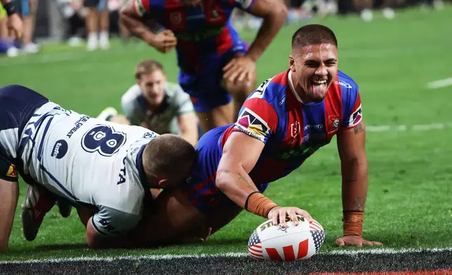 Newcastle Knights Trey Mooney reacts after scoring a try during the Australia National Rugby League game between Newcastle Knights and the North Queensland Cowboys in Las Vegas, Saturday, Feb. 28, 2026. (AP Photo/Ian Maule)