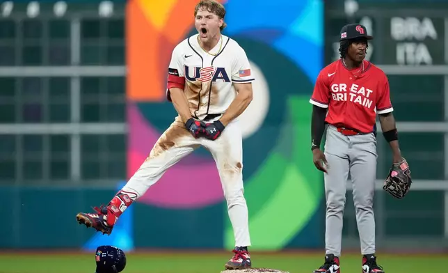 United States' Gunnar Henderson celebrates after a two-run double during the fifth inning of a World Baseball Classic game against Britain, Saturday, March 7, 2026, in Houston. (AP Photo/Ashley Landis)
