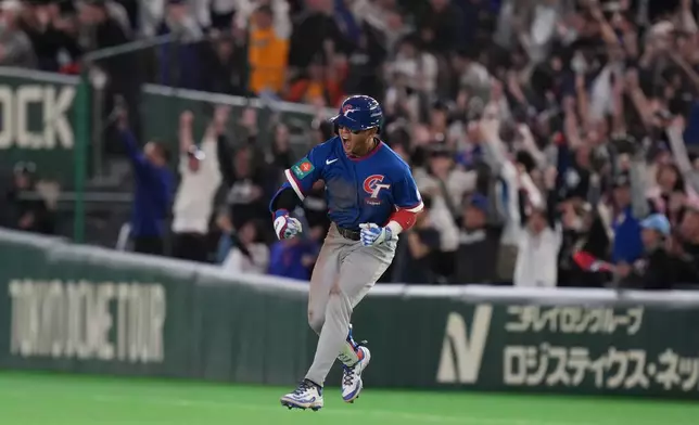 Taiwan's Cheng Tsung-che celebrates his home run during the sixth inning of a World Baseball Classic game between South Korea and Taiwan on Sunday, March 8, 2026 in Tokyo, Japan. (AP Photo/Eugene Hoshiko)
