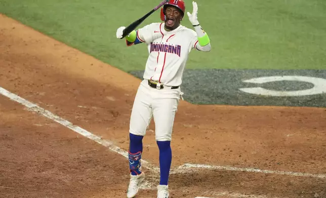 Dominican Republic Geraldo Perdomo reacts after striking out at the end of the ninth inning of a World Baseball Classic semifinal game against the United States, Sunday, March 15, 2026, in Miami. (AP Photo/Rebecca Blackwell)