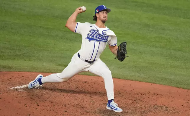 Italy pitcher Michael Lorenzen aims a pitch during the fifth inning of a World Baseball Classic semifinal game against Venezuela, Monday, March 16, 2026, in Miami. (AP Photo/Lynne Sladky)