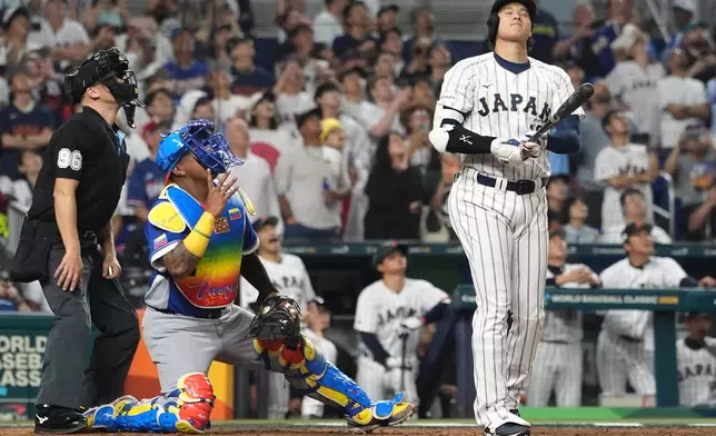 Japan's Shohei Ohtani reacts after fly out during the ninth inning of a World Baseball Classic quarterfinal game against Japan, Saturday, March 14, 2026, in Miami. (AP Photo/Lynne Sladky)