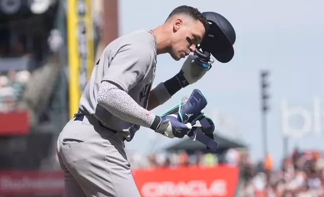 New York Yankees' Aaron Judge reacts after striking out during the third inning of a baseball game against the San Francisco Giants in San Francisco, Friday, March 27, 2026. (AP Photo/Jeff Chiu)