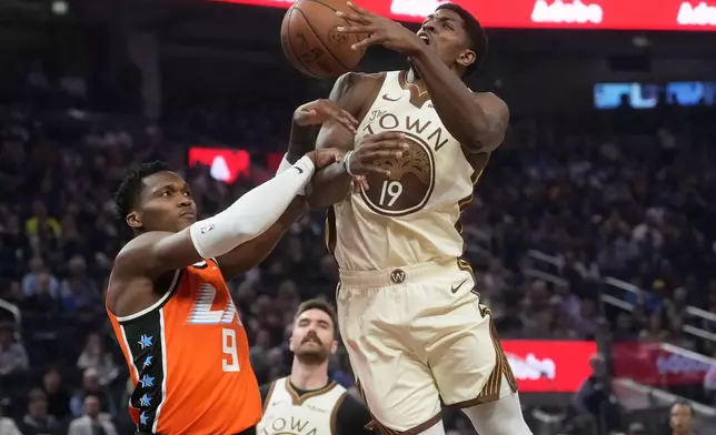 Golden State Warriors guard Nate Williams (19) loses the ball while being defended by Los Angeles Clippers guard Bennedict Mathurin (9) during the first half of an NBA basketball game in San Francisco, Monday, March 2, 2026. (AP Photo/Jeff Chiu)