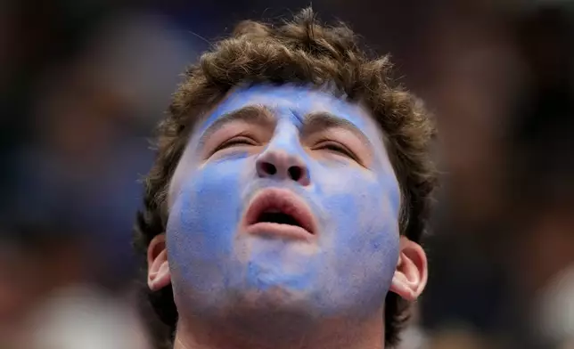 A Duke fan reacts in the final seconds during the second half in the Elite Eight of the NCAA college basketball tournament against UConn, Sunday, March 29, 2026, in Washington. (AP Photo/Stephanie Scarbrough)