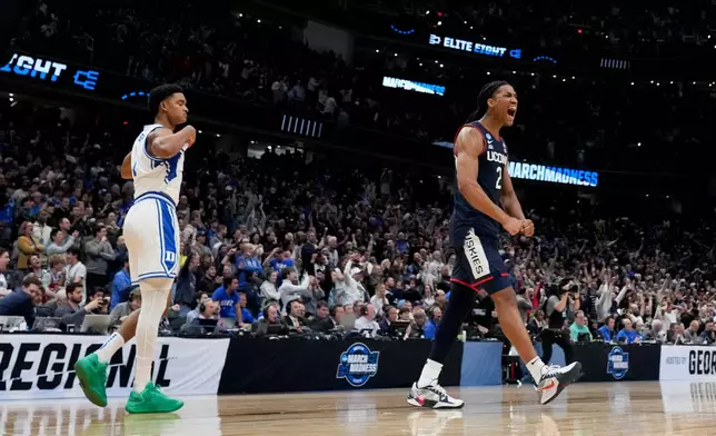 UConn guard Silas Demary Jr. (2) celebrates their win over Duke after the second half in the Elite Eight of the NCAA college basketball tournament, Sunday, March 29, 2026, in Washington. (AP Photo/Stephanie Scarbrough)