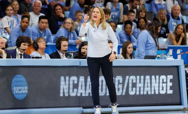 FILE - North Carolina head coach Courtney Banghart gestures towards the court during the first half against West Virginia in the second round of the NCAA college basketball tournament in Chapel Hill, N.C., March 24, 2025. (AP Photo/Ben McKeown, File)
