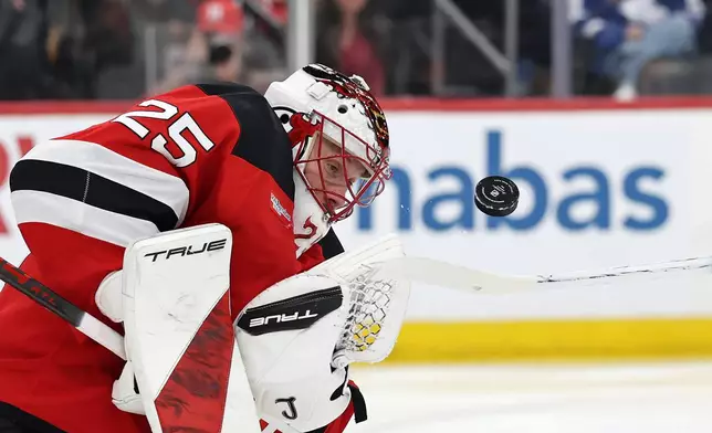 New Jersey Devils goaltender Jacob Markstrom makes a save during the third period of an NHL hockey game against the Toronto Maple Leafs, Wednesday, March 4, 2026, in Newark, N.J. (AP Photo/Adam Hunger)