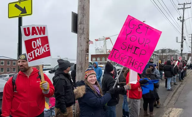 Strikers picketing outside Bath Iron Works in Bath, Maine, on Monday, May 23, 2026. (AP Photo/Rodrique Ngowi)