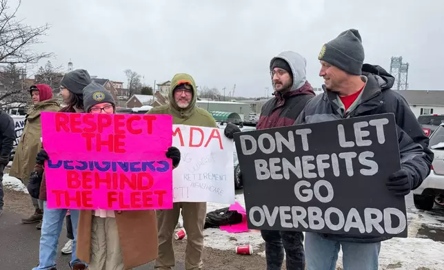 Strikers picketing outside Bath Iron Works in Bath, Maine, on Monday, May 23, 2026. (AP Photo/Rodrique Ngowi)