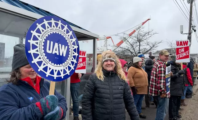 Strikers picketing outside Bath Iron Works in Bath, Maine, on Monday, May 23, 2026. (AP Photo/Rodrique Ngowi)