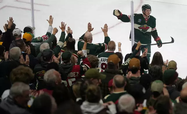 Minnesota Wild left wing Matt Boldy celebrates after scoring a goal during the second period of an NHL hockey game against the Utah Mammoth, Tuesday, March 10, 2026, in St. Paul, Minn. (AP Photo/Abbie Parr)