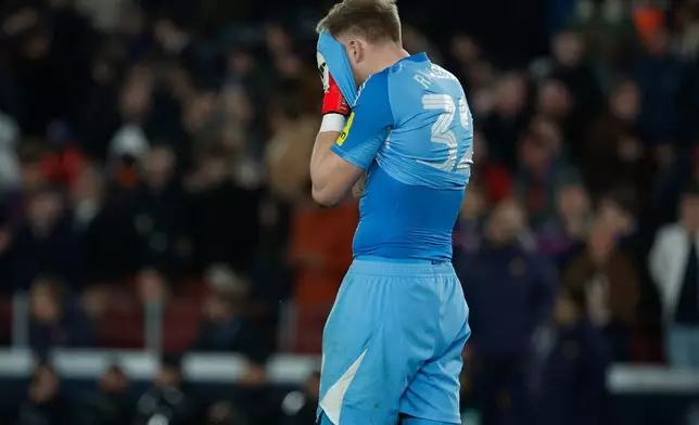 Newcastle's goalkeeper Aaron Ramsdale reacts after the seventh goal of Barcelona during the Champions League round of 16, second leg soccer match between FC Barcelona and Newcastle United FC in Barcelona, Spain, Wednesday, March 18, 2026. (AP Photo/Joan Monfort)