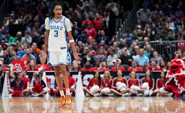 Duke guard Isaiah Evans (3) reacts to a three pointer against St. John's during the second half in the Sweet 16 of the NCAA college basketball tournament, Friday, March 27, 2026, in Washington. (AP Photo/Stephanie Scarbrough)