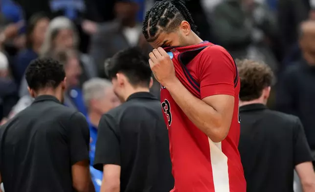 St. John's forward Bryce Hopkins leaves the court after the second half in the Sweet 16 of the NCAA college basketball tournament against Duke, Friday, March 27, 2026, in Washington. (AP Photo/Stephanie Scarbrough)