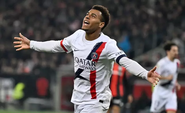PSG's Desire Doue celebrates after scoring his side's second goal during the French League One soccer match between Nice and Paris Saint-Germain in Nice, France, Saturday, March 21, 2026. (AP Photo/Philippe Magoni)