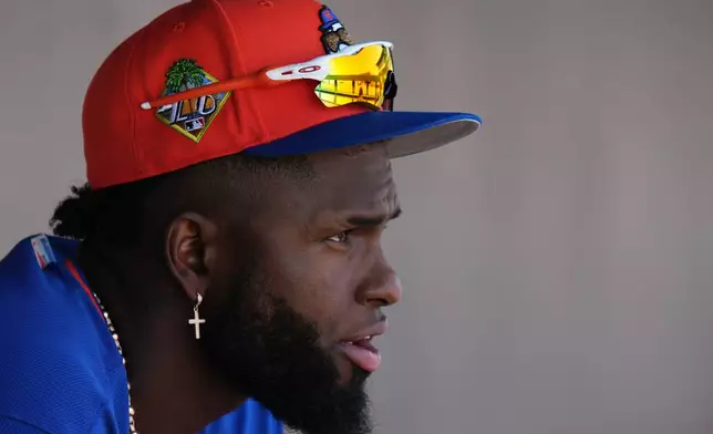 New York Mets' Luis Robert Jr. looks out from the dugout during a spring training baseball game against the Miami Marlins, Sunday, March 22, 2026, in Jupiter, Fla. (AP Photo/Lynne Sladky)