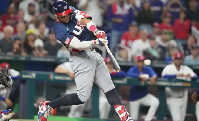 United States' Aaron Judge (99) hits a single during the first inning of a World Baseball Classic semifinal game against the Dominican Republic, Sunday, March 15, 2026, in Miami. (AP Photo/Lynne Sladky)