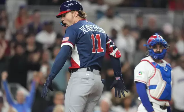 United States' Gunnar Henderson (11) celebrates after hitting a home run during the fourth inning of a World Baseball Classic semifinal game against the Dominican Republic, Sunday, March 15, 2026, in Miami. (AP Photo/Lynne Sladky)