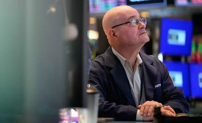 Anthony Confusione works on the floor at the New York Stock Exchange in New York, Tuesday, March 3, 2026. (AP Photo/Seth Wenig)