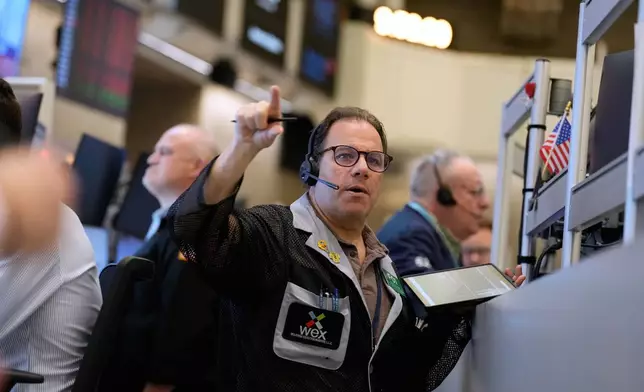 Anthony Spina works on the floor at the New York Stock Exchange in New York, Tuesday, March 3, 2026. (AP Photo/Seth Wenig)
