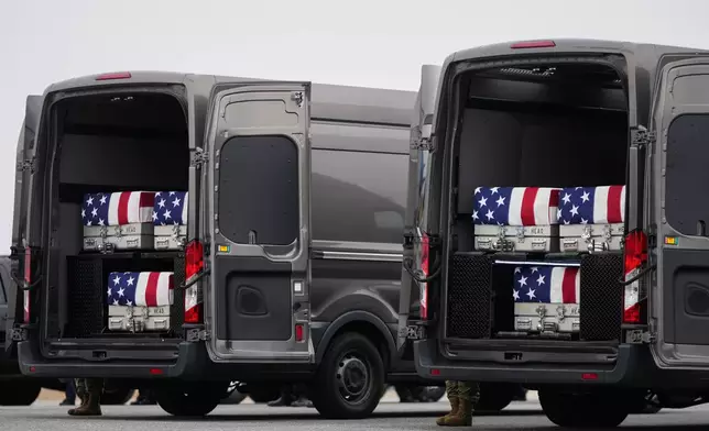 Transfer vans containing the remains of U.S. Army Reserve soldiers Maj. Jeffrey O'Brien, 45, of Indianola, Iowa, Capt. Cody Khork, 35, of Winter Haven, Florida, Chief Warrant Officer 3 Robert Marzan, 54, of Sacramento, Sgt. 1st Class Nicole Amor, 39, of White Bear Lake, Minnesot, Sgt. 1st Class Noah Tietjens, 42, of Bellevue, Nebraska and Sgt. Declan Coady, 20, of West Des Moines, Iowa, who were killed in a drone strike at a command center in Kuwait one day after the U.S. and Israel launched its military campaign against Iran, during a casualty return, Saturday, March 7, 2025, at Dover Air Force Base, Del. (AP Photo/Julia Demaree Nikhinson)