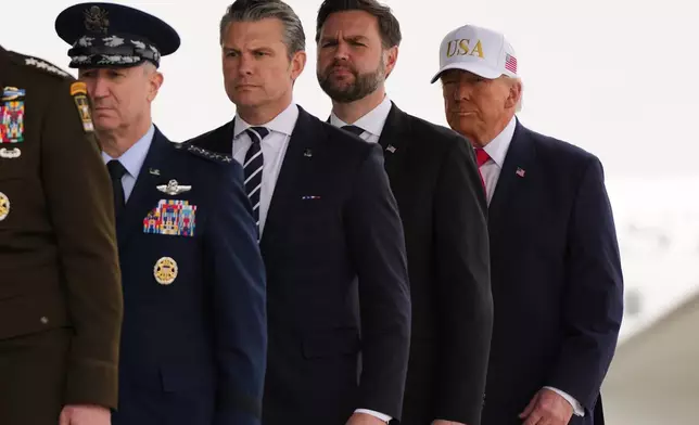 President Donald Trump, from right, Vice President JD Vance, Defense Secretary Pete Hegseth, Chairman of the Joint Chiefs of Staff Gen. Dan Caine, walk after a prayer during a casualty return for the six U.S. Army Reserve soldiers who were killed in a drone strike at a command center in Kuwait after the U.S. and Israel launched its military campaign against Iran, during a casualty return Saturday, March 7, 2026, at Dover Air Force Base, Del. (AP Photo/Julia Demaree Nikhinson)