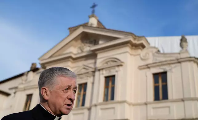 FILE - Archbishop of Chicago, Cardinal Blase Cupich, answers a journalist's question during an interview with The Associated Press, in front of St. Bartholomew church, in Rome, Thursday, Oct. 9, 2025. (AP Photo/Gregorio Borgia, File)