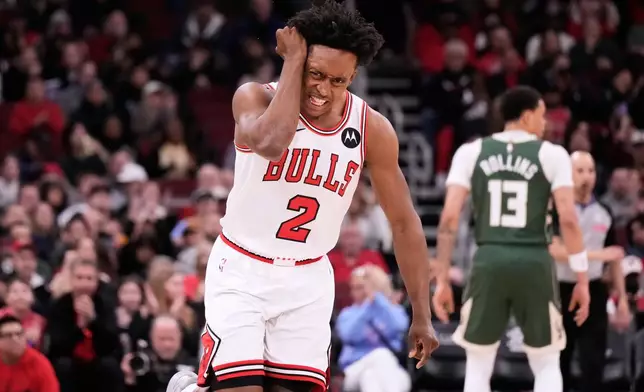 Chicago Bulls guard Collin Sexton reacts after scoring a 3-point basket during the first half of an NBA basketball game against the Milwaukee Bucks in Chicago, Sunday, March 1, 2026. (AP Photo/Nam Y. Huh)