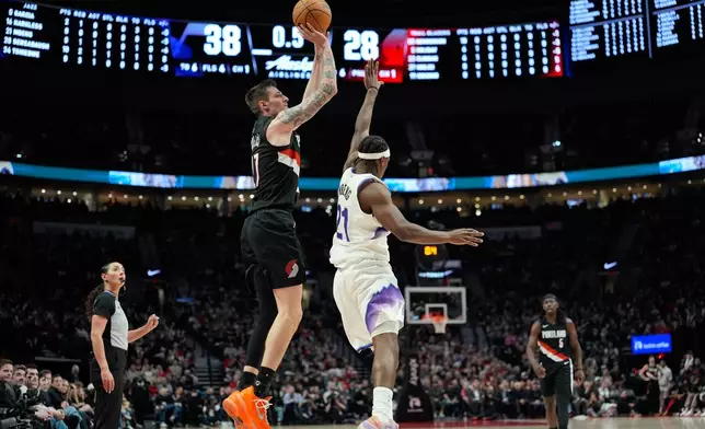Portland Trail Blazers guard Vít Krejčí shoots during the first half of an NBA basketball game against the Utah Jazz, Friday, March 13, 2026, in Portland, Ore. (AP Photo/Jenny Kane)