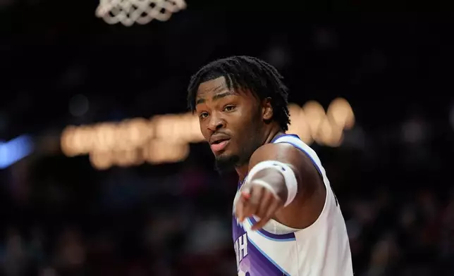 Utah Jazz guard Isaiah Collier reacts during the first half of an NBA basketball game against the Portland Trail Blazers, Friday, March 13, 2026, in Portland, Ore. (AP Photo/Jenny Kane)