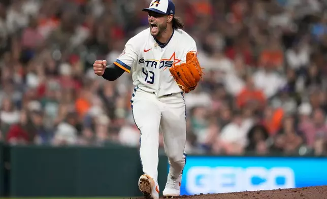 Houston Astros starting pitcher Lance McCullers Jr. celebrates after the top of the seventh inning of a baseball game against the Boston Red Sox in Houston, Monday, March 30, 2026. (AP Photo/Ashley Landis)
