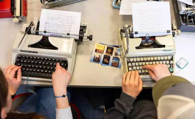 Student use typewriters to complete a writing assignment in German at Cornell University, Friday, March 20, 2026, in Ithaca, N.Y. The professor, Grit Matthias Phelps, brings out the typewriters once each semester for students to disconnect from technology and connect with the assignment in a different way. (AP Photo/Lauren Petracca)