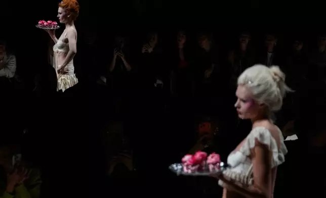 Models wear creations by Russian brand Masterpeace on a runway at the Moscow Fashion Week in Moscow, Saturday, March 14, 2026. (AP Photo/Pavel Bednyakov)