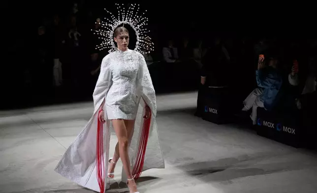 A model wears a creation by Russian brand Big Brooch on a runway at the Moscow Fashion Week in Moscow, Saturday, March 14, 2026. (AP Photo/Pavel Bednyakov)