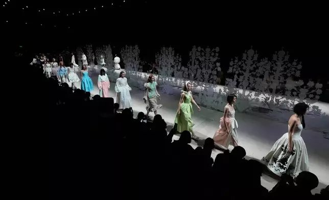 Models wear creations by Russian designer Alena Akhmadullina on a runway at the Moscow Fashion Week in Moscow, Saturday, March 14, 2026. (AP Photo/Pavel Bednyakov)
