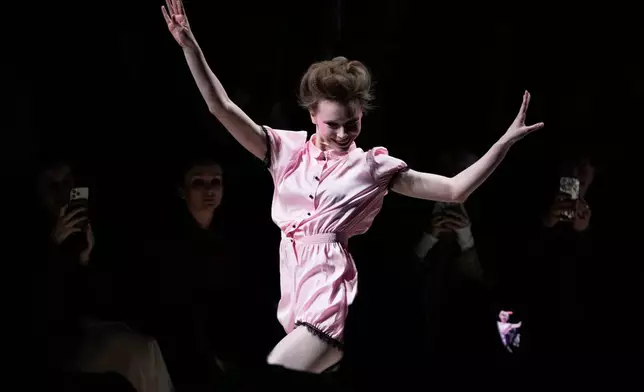 A model wears a creation by Russian brand Masterpeace on a runway at the Moscow Fashion Week in Moscow, Saturday, March 14, 2026. (AP Photo/Pavel Bednyakov)