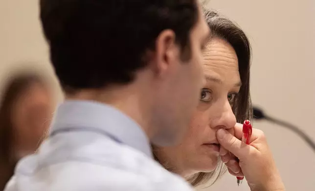 Defense attorney Staci Visser, left, and defendant Tyler Robinson, accused in the fatal shooting of conservative activist Charlie Kirk, attend a hearing in 4th District Court, Friday, March. 13, 2026, in Provo, Utah. (Laura Seitz/The Deseret News via AP, Pool)