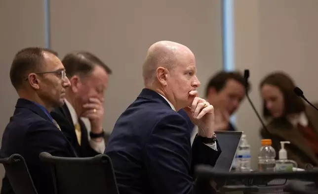 Prosecutor Chad Grunander, center, listens, Friday, March. 13, 2026, in 4th District Court in Provo, Utah, during a hearing for Tyler Robinson, who is accused in the fatal shooting of conservative activist Charlie Kirk. (Laura Seitz/The Deseret News via AP, Pool)