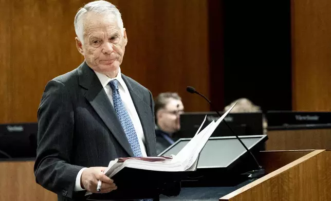 Attorney Michael Burt returns to his seat after addressing Fourth District Court Judge Tony Graf during a hearing for Tyler Robinson, accused in the fatal shooting of conservative activist Charlie Kirk, in 4th District Court, on Friday, March. 13, 2026, in Provo, Utah. (Laura Seitz /The Deseret News via AP, Pool)