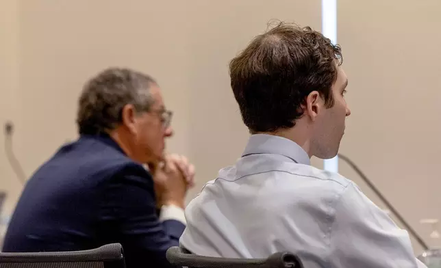 Attorney Richard Novak, left, and defendant Tyler Robinson, accused in the fatal shooting of conservative activist Charlie Kirk, attend a hearing, in 4th District Court, Friday, March. 13, 2026, in Provo, Utah. (Laura Seitz/The Deseret News via AP, Pool