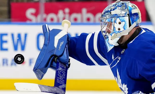 Toronto Maple Leafs goaltender Anthony Stolarz a save during third-period NHL hockey game action against the Philadelphia Flyers in Toronto, Monday, March 2, 2026. (Frank Gunn/The Canadian Press via AP)