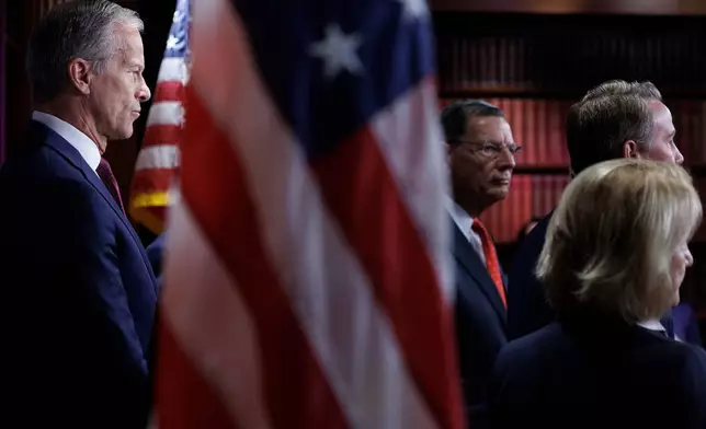 Senate Majority Leader John Thune R-S.D., looks on as fellow Republicans take questions from reporters during a news conference on Capitol Hill on Saturday, March 21, 2026, in Washington. (AP Photo/Tom Brenner)