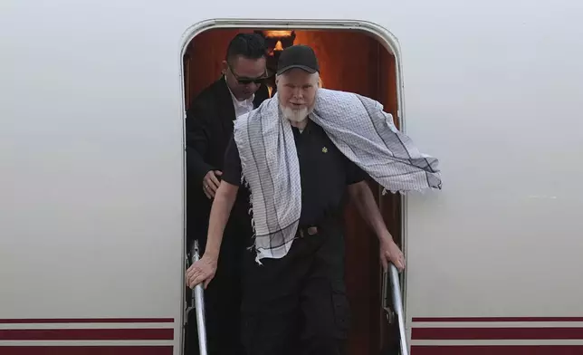 American Dennis Coyle, who was released by Afghanistan's Taliban authorities who had held him for over a year, arrives in San Antonio, Wednesday, March 25, 2026. (AP Photo/Eric Gay)