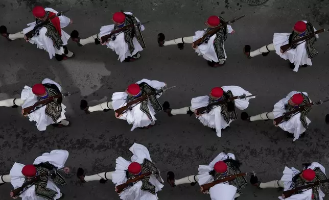 Presidential Guards also known as Evzones, take part in a military parade to commemorate the start of Greece's 1821 war of independence against the 400-year Ottoman rule, in Athens, on Wednesday, March 25, 2026. (AP Photo/Thanassis Stavrakis)