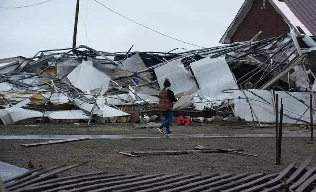 A storm-damaged Tholens' Landscape &amp; Garden center is seen in the aftermath of a powerful storm that ripped through the area a day earlier in Kankakee, Ill., Wednesday, March 11, 2026. (AP Photo/Nam Y. Huh)